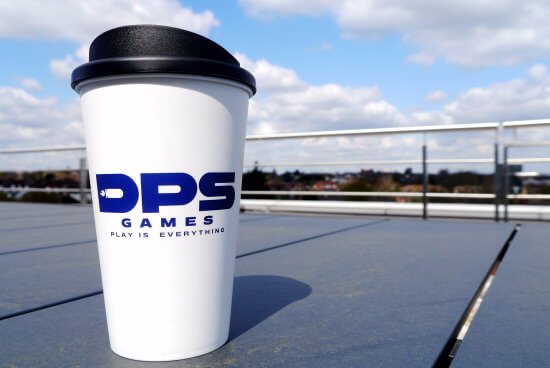 Coffee Cup on balcony with blue cloudy sky